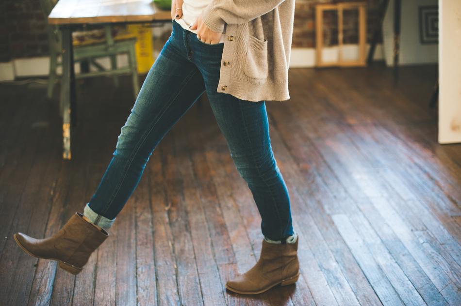 woman in jeans and leather boots