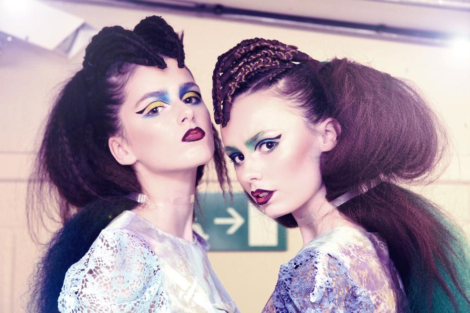 Portrait of the girls with colorful make-up and hairstyles, in the backstage