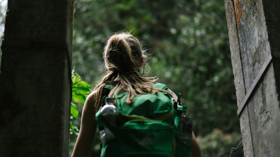 Woman with Backpack in doorway