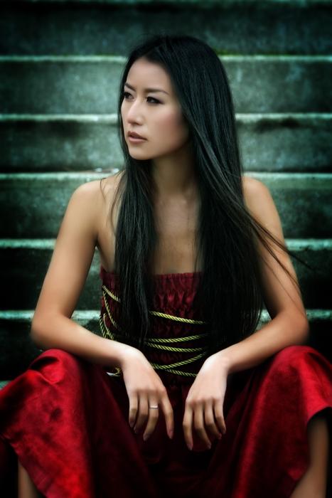 photo of asian model sitting on the steps