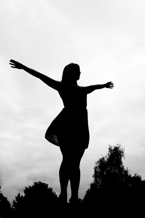 silhouette of a woman in nature