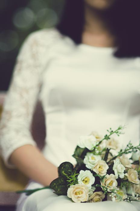 Bride in white dress and with white flowers in Hanoi Vietnam