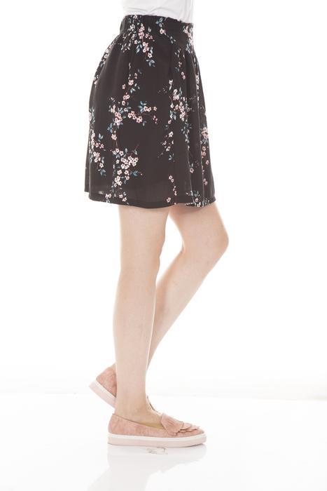woman in skirt on white background