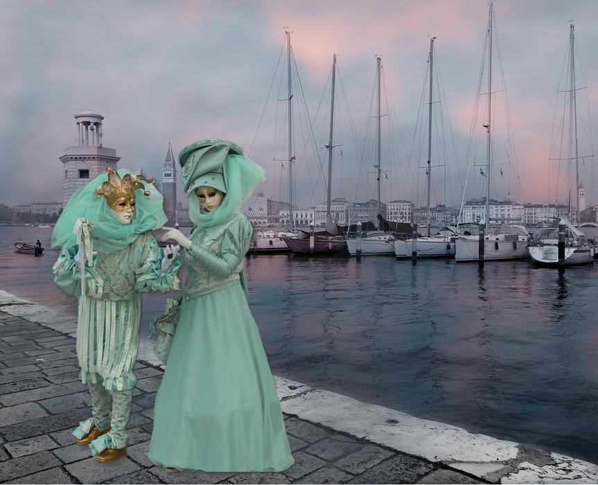 couple in carnival party on the embankment of venice