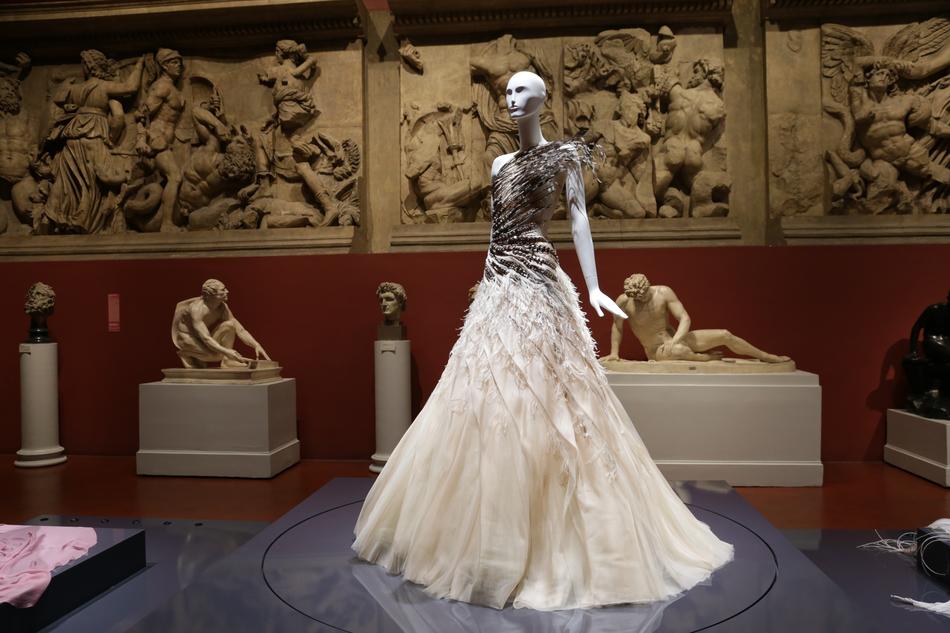 photo of a wedding dress on a mannequin in a museum