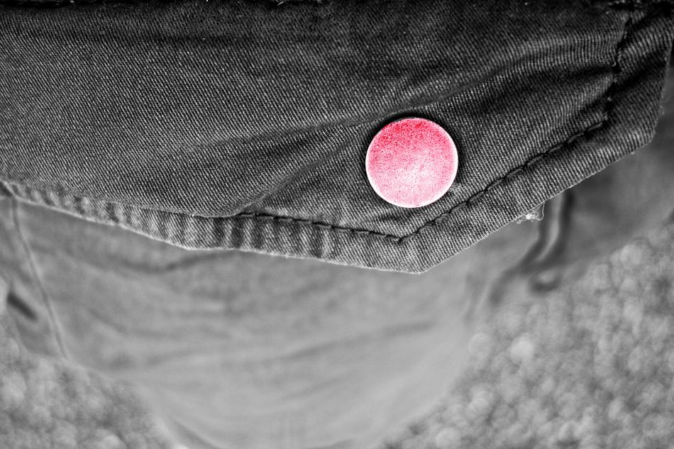 Beautiful, red flap on the black pants pocket