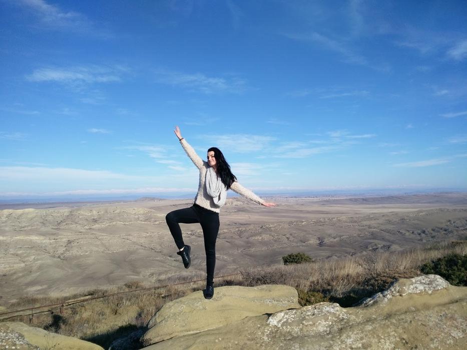 girl stone sky