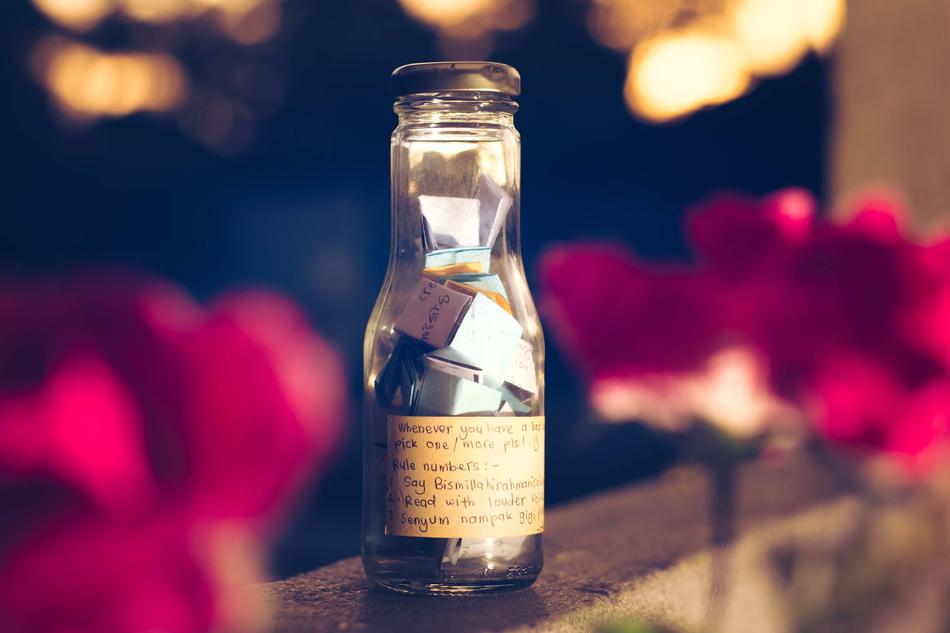 bottle with wishes on a blurred background