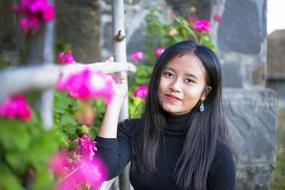 Asian girl with pink flowers