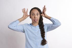 pigtailed woman fooling around