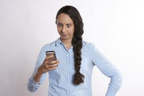 emotional woman with a phone in her hand