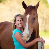 photo of woman hugging horse