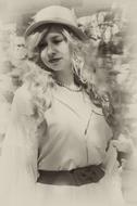 Retro photo of the beautiful woman with curly hair, in hat in Russia