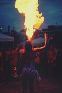 girl breathes fire at the performance