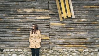 Young Person Girl at wooden wall