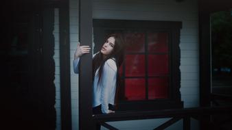 Girl in Jacket near Window