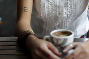 woman with a cup of coffee close up