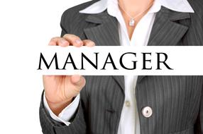 Manager, board in hand of Businesswoman