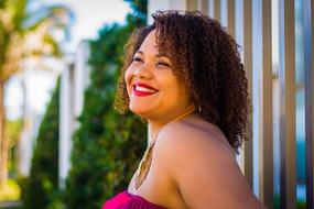 beautiful girl near the wall on a blurred background