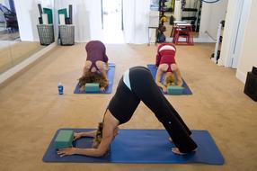 girls doing yoga in the gym