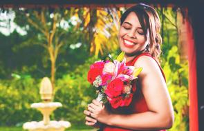 woman with a bouquet of flowers on a blurred background