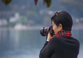 Asian woman with camera