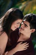 Portrait of the smiling couple together, at blurred background