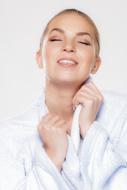 happy woman in white bathrobe