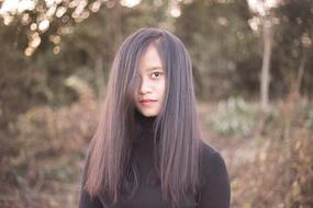 photo of asian girl with long hair outdoors
