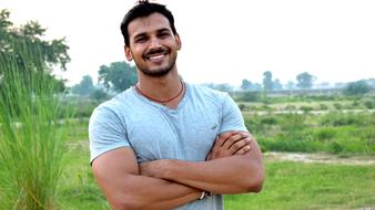 handsome young man posing in nature