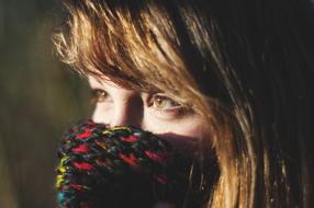 woman with colorful scarf close up on blurred background