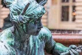 woman statue on blurred background in hamburg