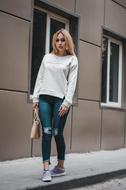 girl in jeans on a city street