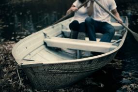 couple on a boat on the lake in a blurred background