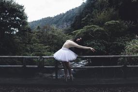 ballet dancer on bridge