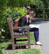 Girlsitting on bench in park