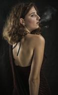 woman in black posing with a cigarette