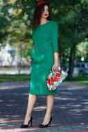 Female in green dress on street