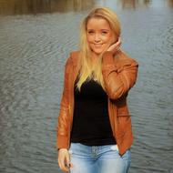 happy smiling Woman in leather jacket on waterside