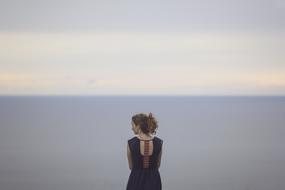 girl in dress on the background of the sea