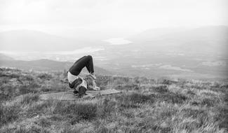 Landscape of Yoga exercising on Mountain