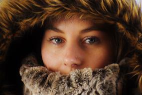 portrait of a girl in a warm hood