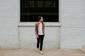 Man Guy and white building wall