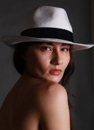 attractive asian woman in white hat portrait