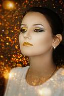 lovely woman in gold makeup