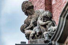 stone statue of mother with children in Hamburg, Germany