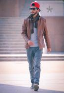 guy in red cap and jeans
