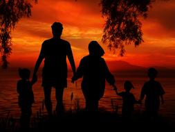 Silhouettes of the family with children, near the water, at colorful and beautiful sunset, clipart