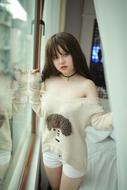 Asian girl posing in bedroom