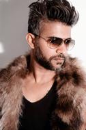 male model in sunglasses and fur coat